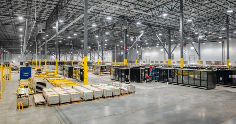 Material handling equipment staged on the warehouse floor at Amazon SNJ5, Jersey City NJ